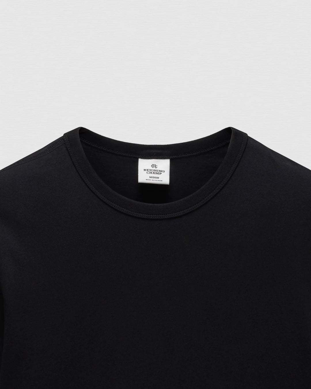 STANDARD JERSEY T-SHIRT (BLACK) - REIGNING CHAMP