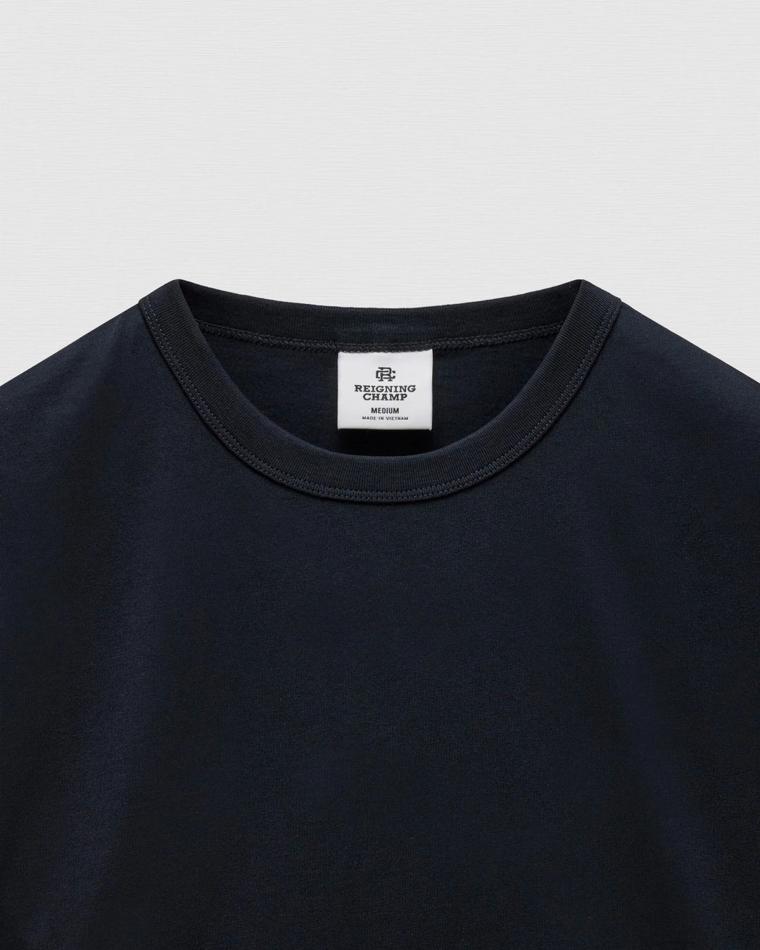 STANDARD JERSEY T-SHIRT (NAVY) - REIGNING CHAMP